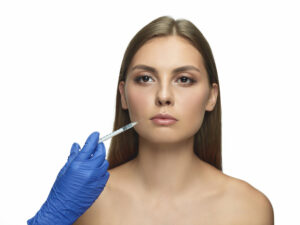 Woman getting Botox injection for smile lines